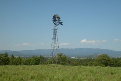 The old windmill homestead.  In the 1930's the husband here was found dead in the pigpen, seemingly trompled by the pigs.  A couple months later the hired hand ran off with his widow.  The odd part was the next tenant was moving a pile of rocks and under it he found a pistol...